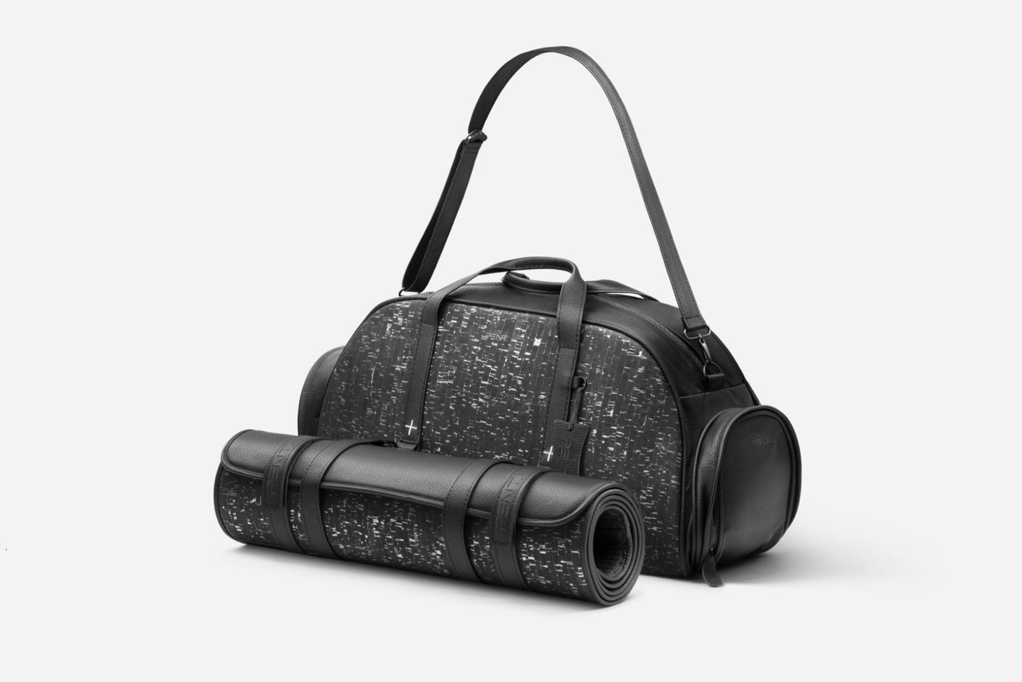 Luxurious TORBA fitness bag in genuine leather with cork accents, featuring a matching rolled yoga mat for style and functionality.