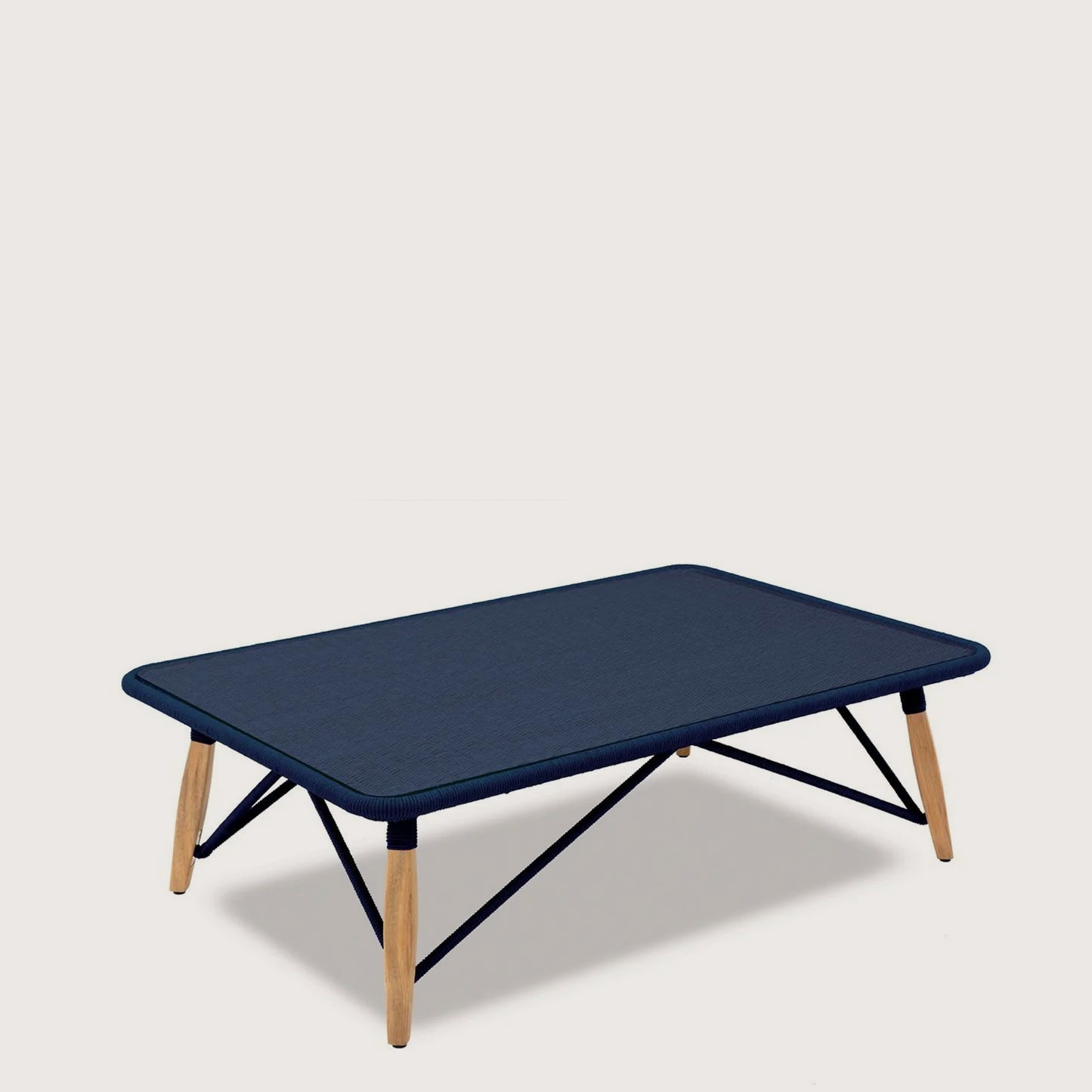 Elegant PIMLICO CLUB 120cm coffee table with sleek dark blue surface and wooden legs, perfect for modern living spaces.