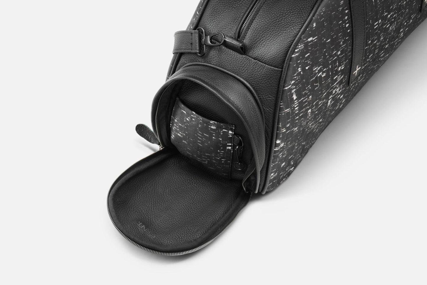 Stylish Torba fitness bag displaying an open compartment, made of genuine leather with unique cork accents and sleek design.