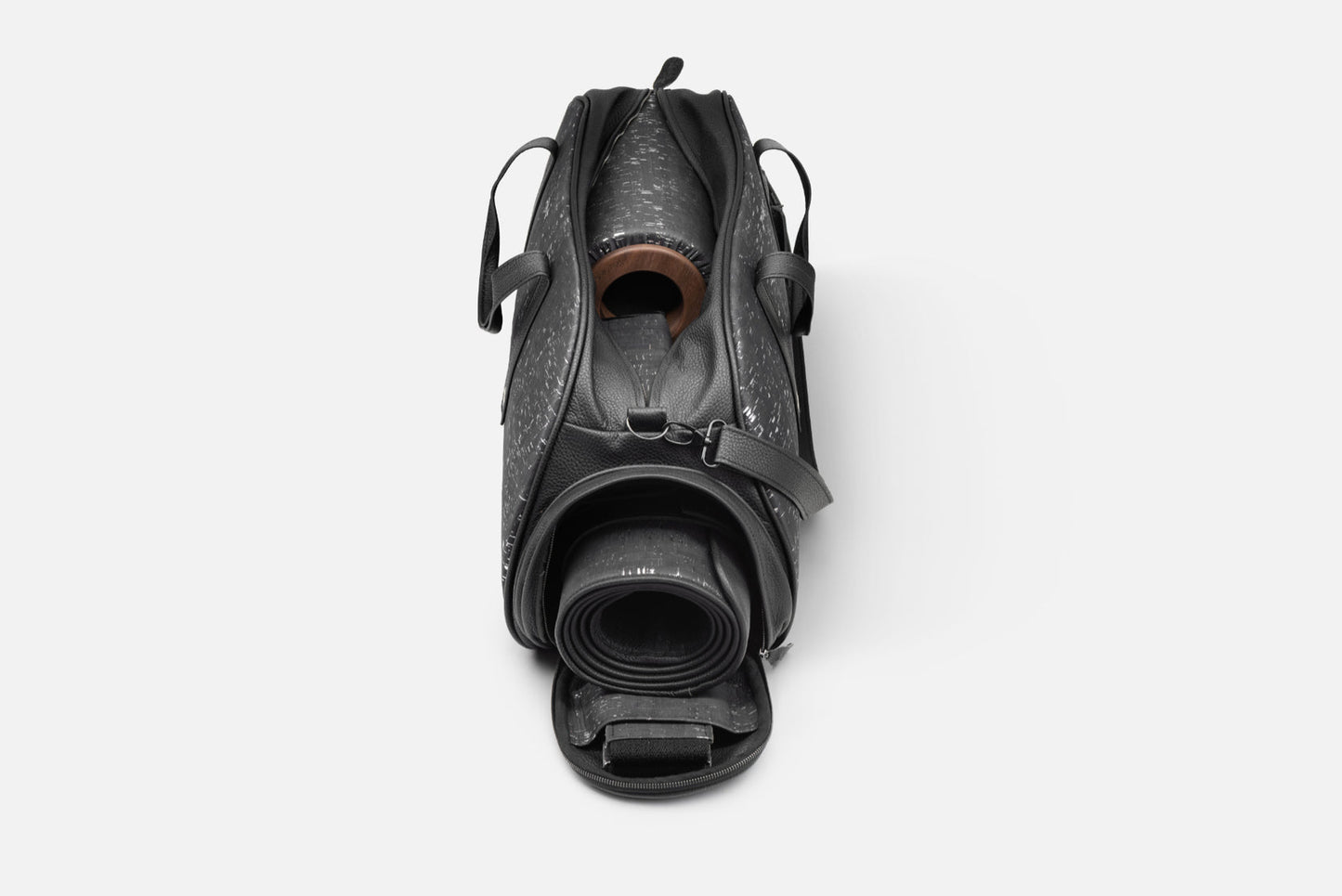 Elegant TORBA fitness bag in genuine leather with cork accents, displaying spacious interior and rolled mat storage.